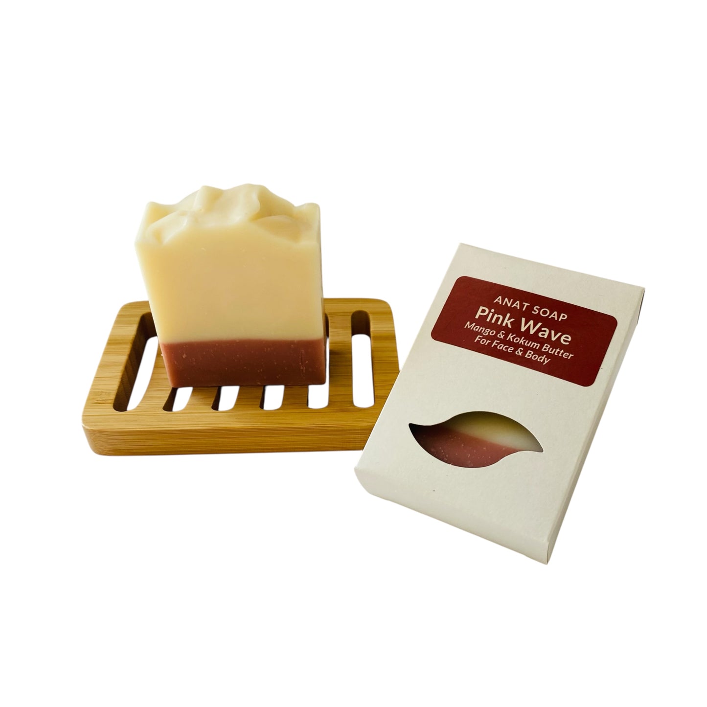 Anat Soap Pink Wave handmade plant-based soap bar with mango and kokum butter for face and body, shown on a bamboo soap dish next to the product box.