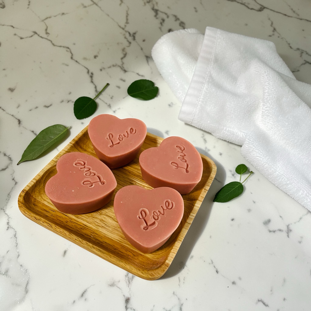 Rose clay mini heart soap set on wooden tray with towel, handmade fragrance-free soap